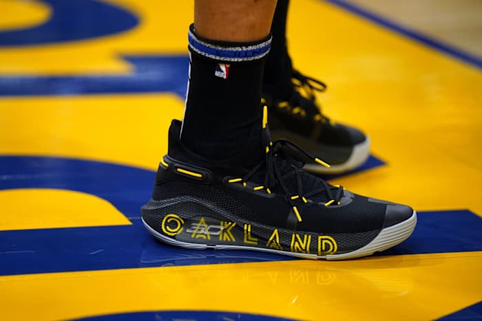 Golden State Warriors point guard Stephen Curry wearing the Under Armour Curry 6 'Thank You'.